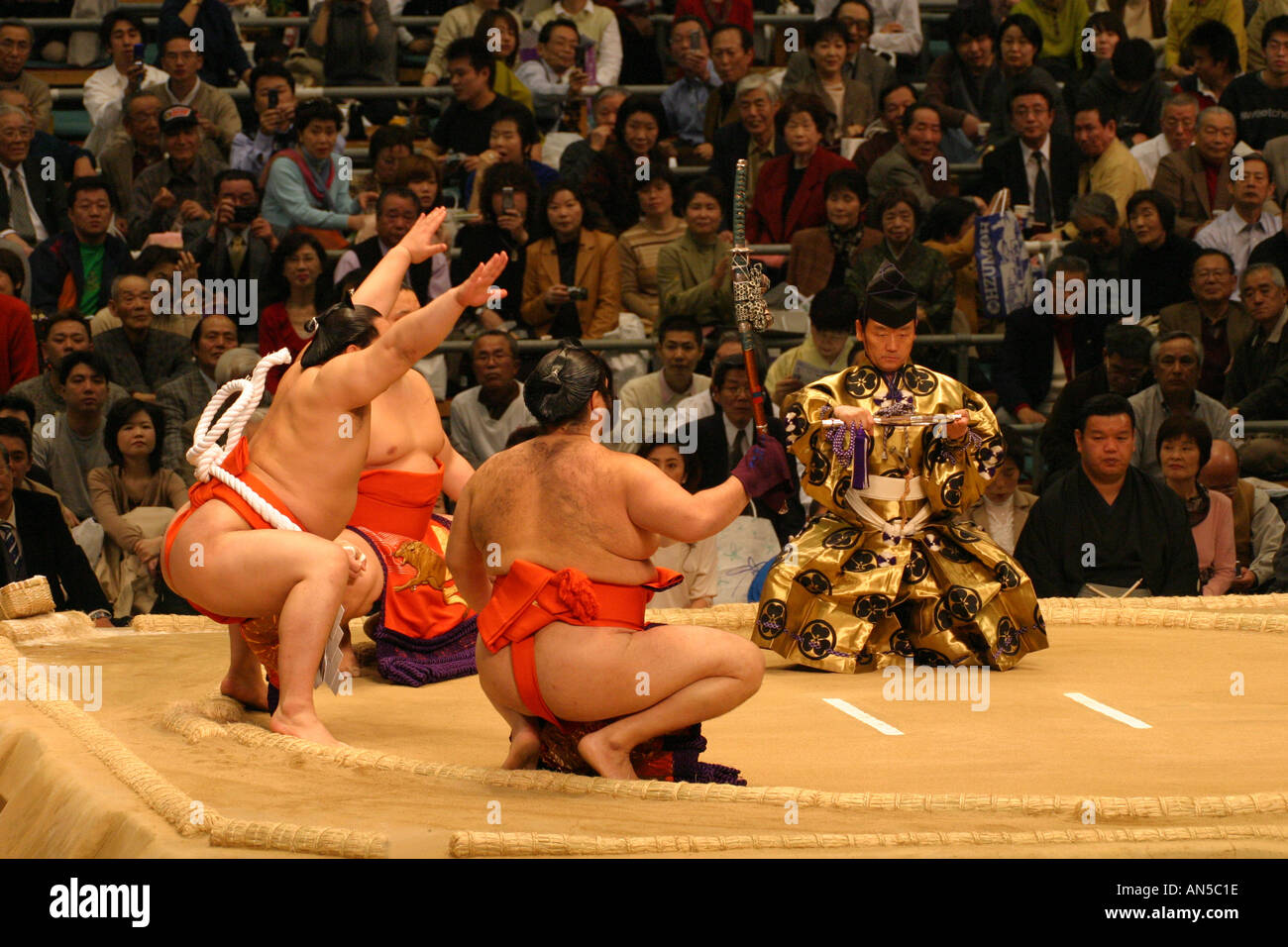 A Sumo wrestling Grand Champion Yokazuna completes a traditional pre fight  ceremony, Osaka Japan Asia Stock Photo - Alamy