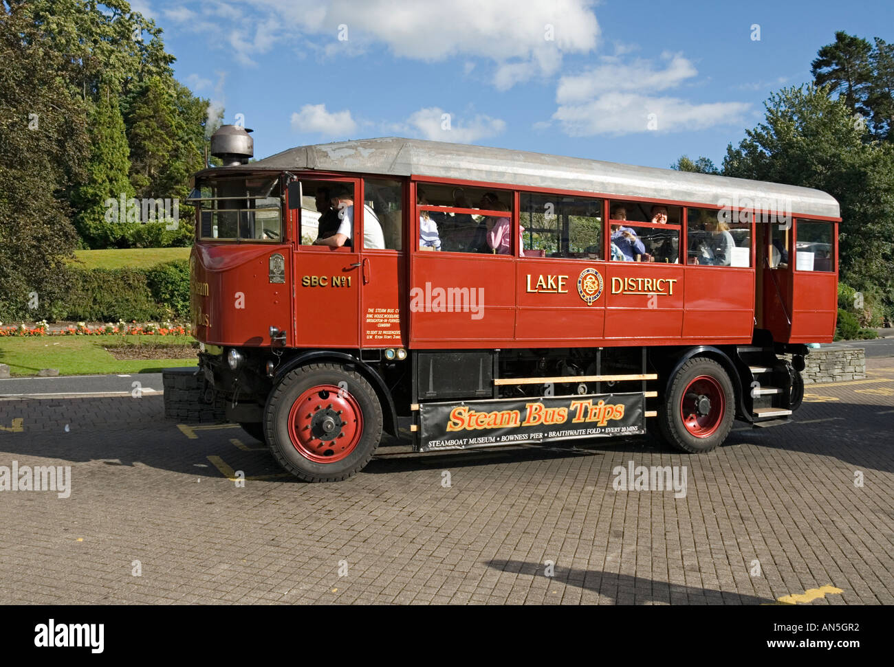 Steam bus departing from Lake Windermere Cumbria for a sightseeing tour Stock Photo
