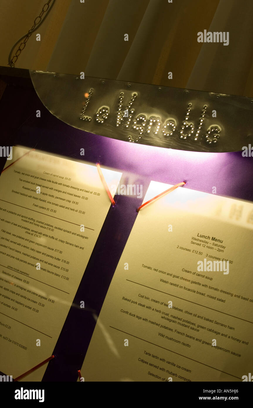 Menu in the window of the Le Vignoble Y Gwinllan french restaurant Aberystwyth Ceredigion Wales Stock Photo