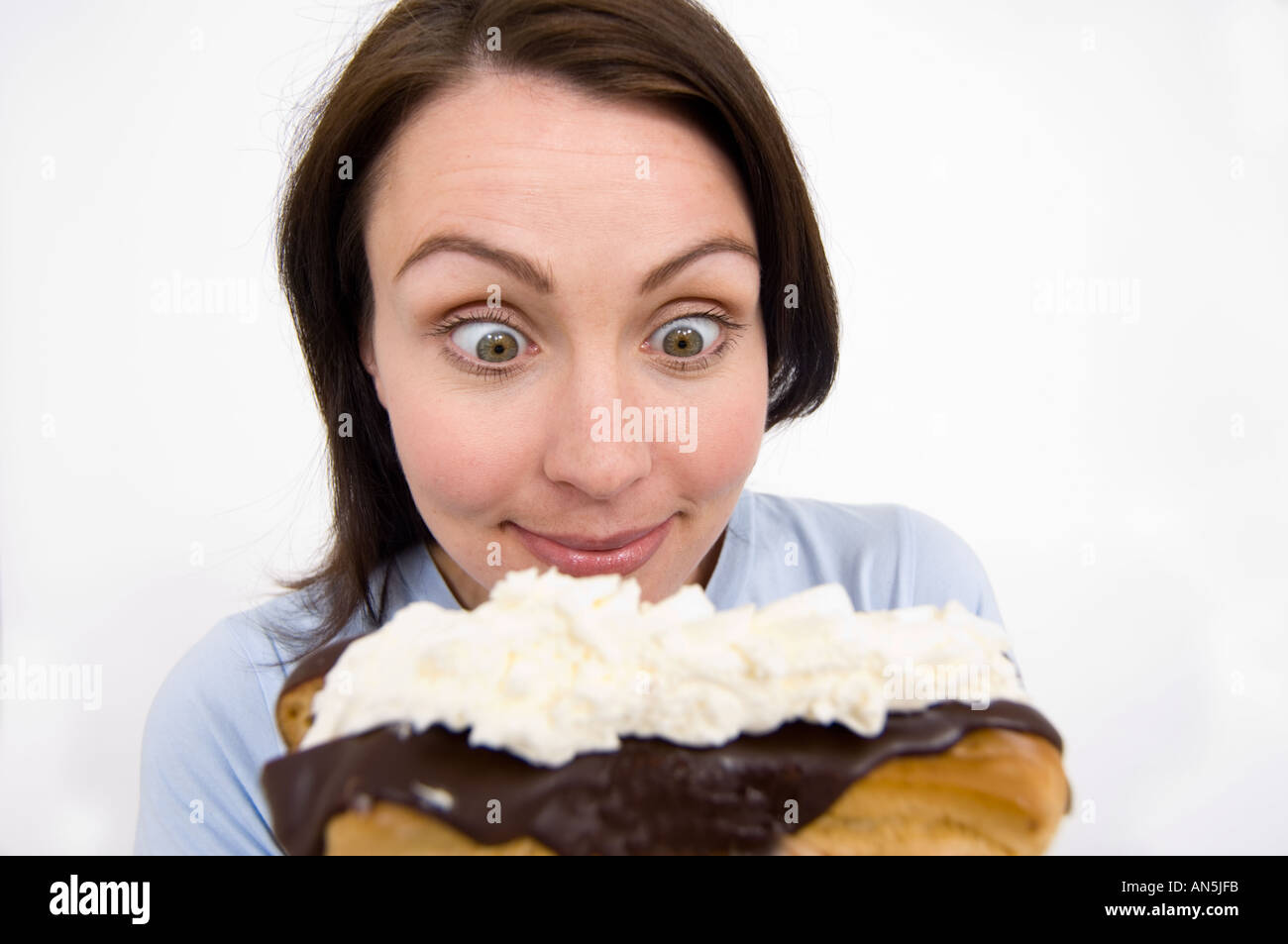 woman about to eat a chocolate slice Stock Photo