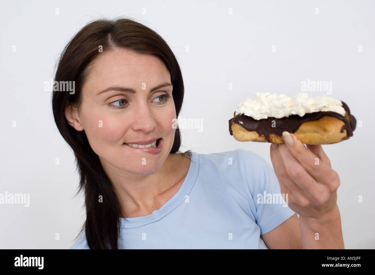 woman about to eat a chocolate slice Stock Photo