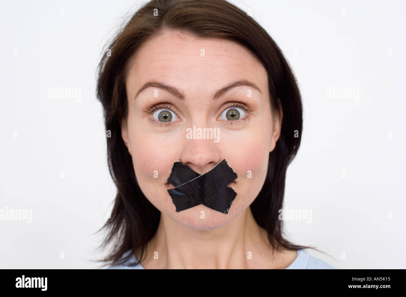 woman with her mouth taped up Stock Photo