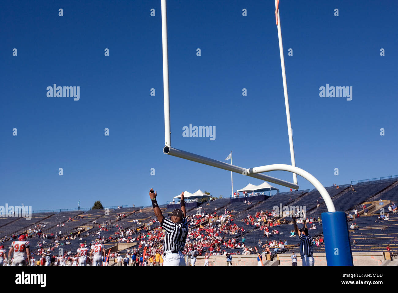 Football referees signaling a field goal Stock Photo Alamy
