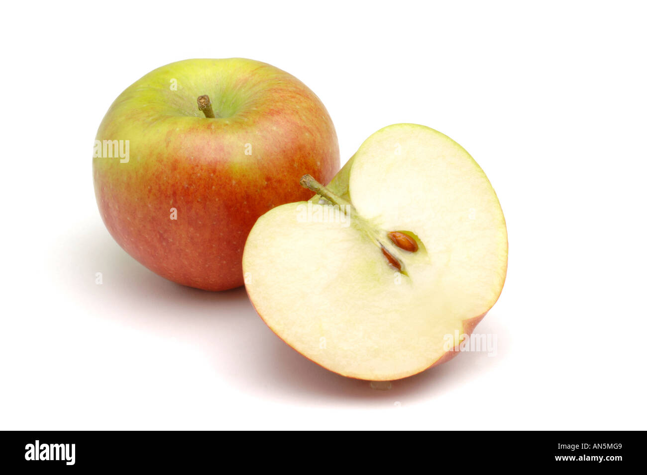 British Braeburn apples one halved on white background Stock Photo Alamy