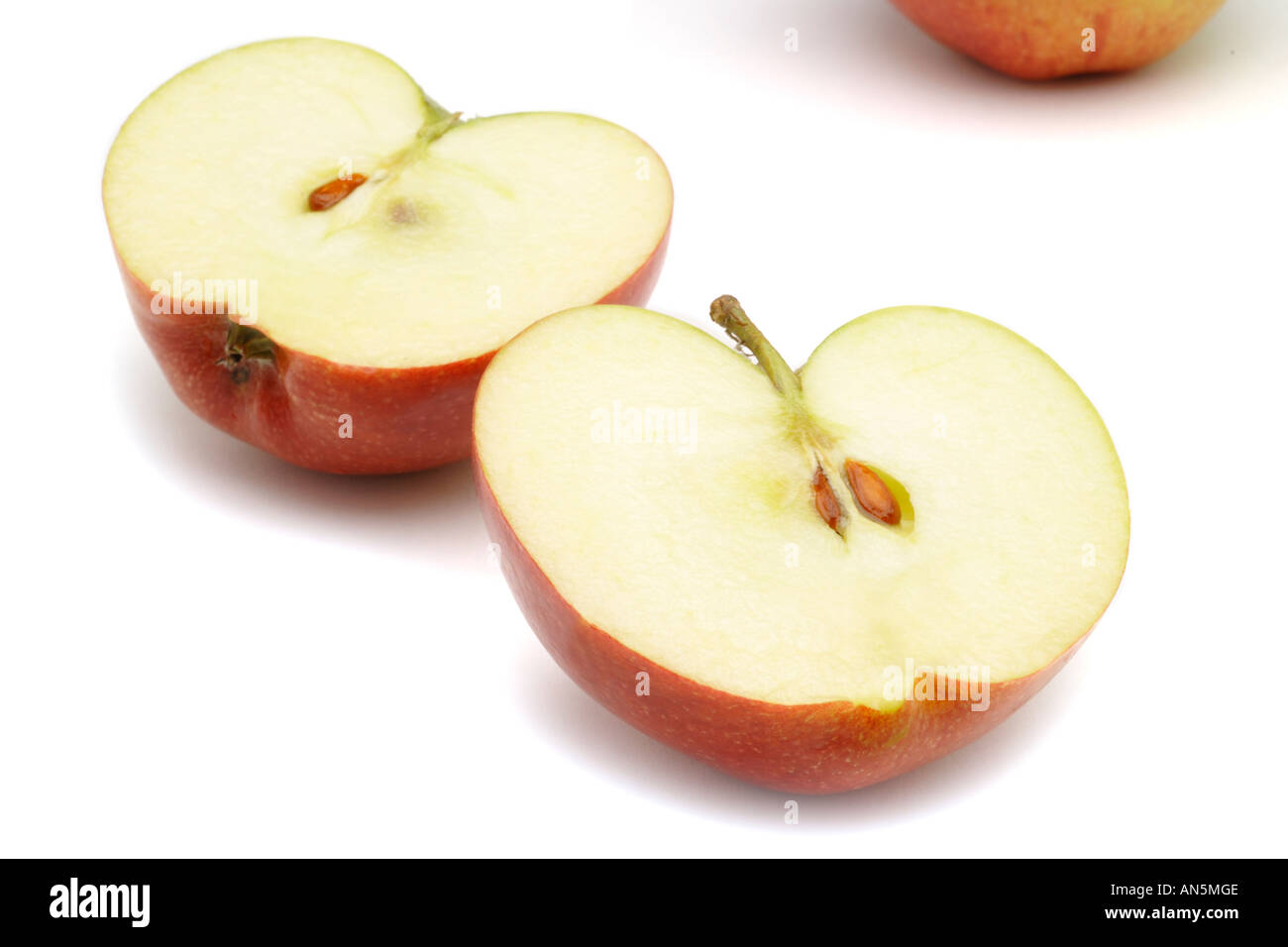 British Braeburn apple halved on white background Stock Photo Alamy
