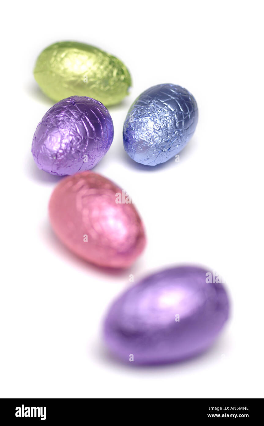Foil covered easter eggs on white background Stock Photo
