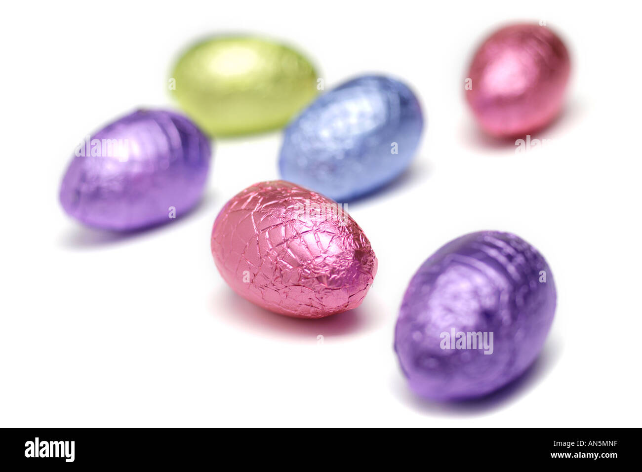 Foil covered easter eggs on white background Stock Photo