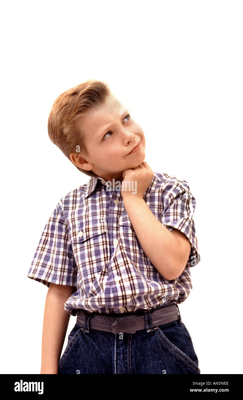 Young boy pondering thoughts Stock Photo