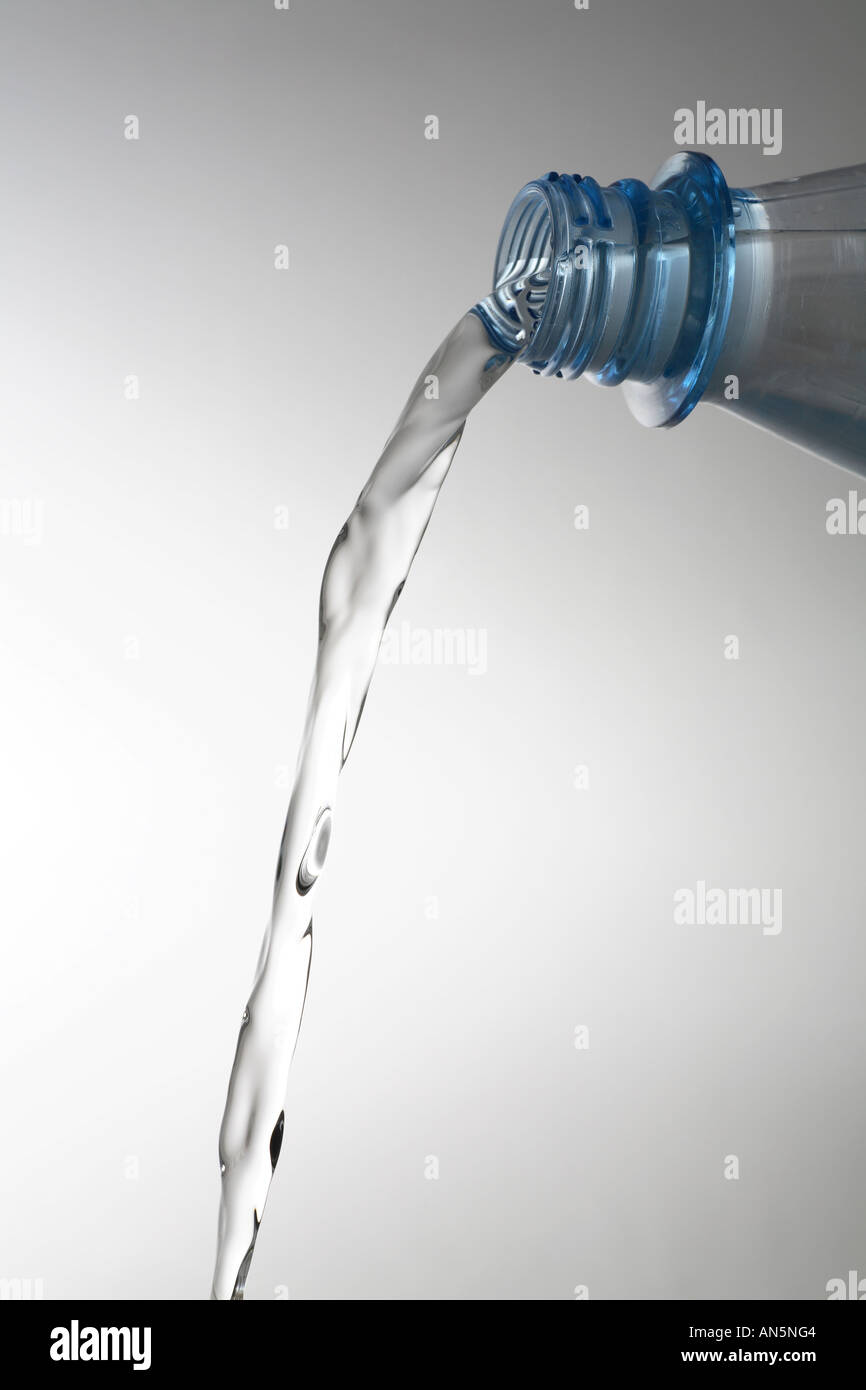 Blue bottle water pour Stock Photo Alamy