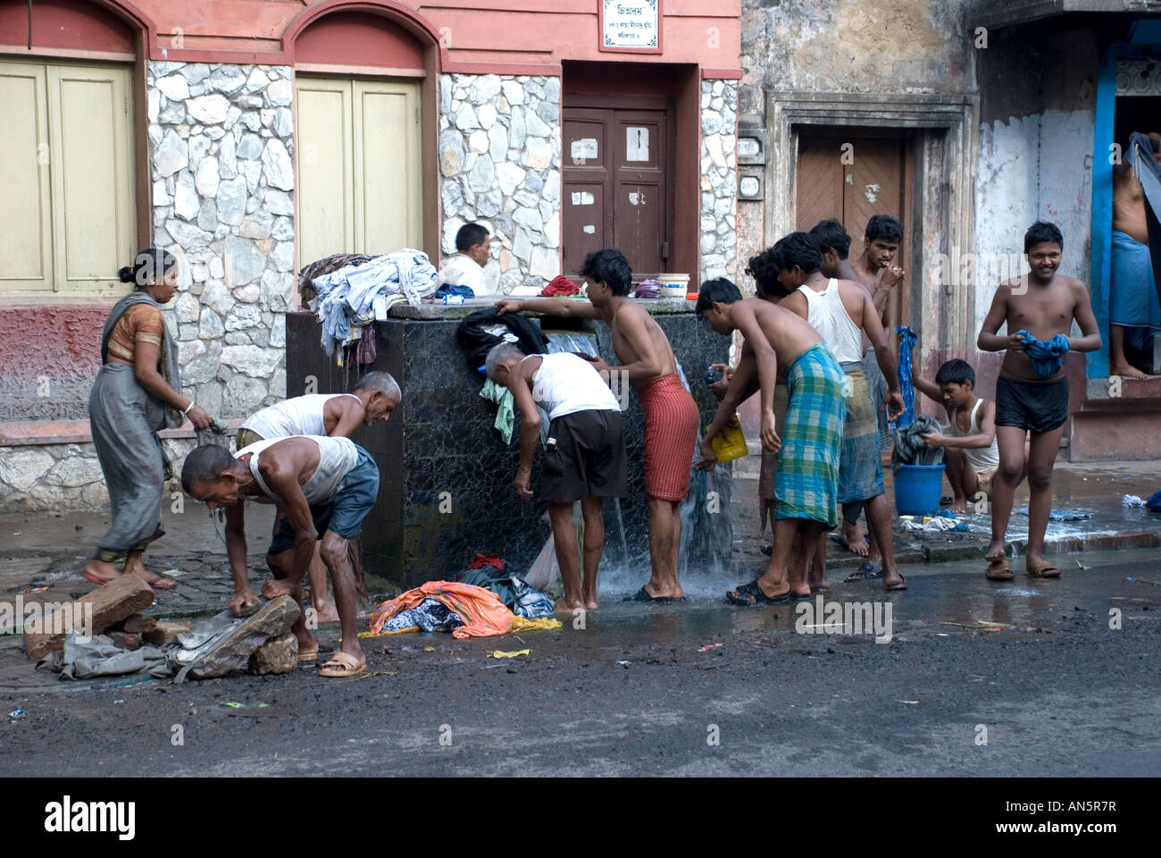 washing on the street, kolkata, india Stock Photo Alamy