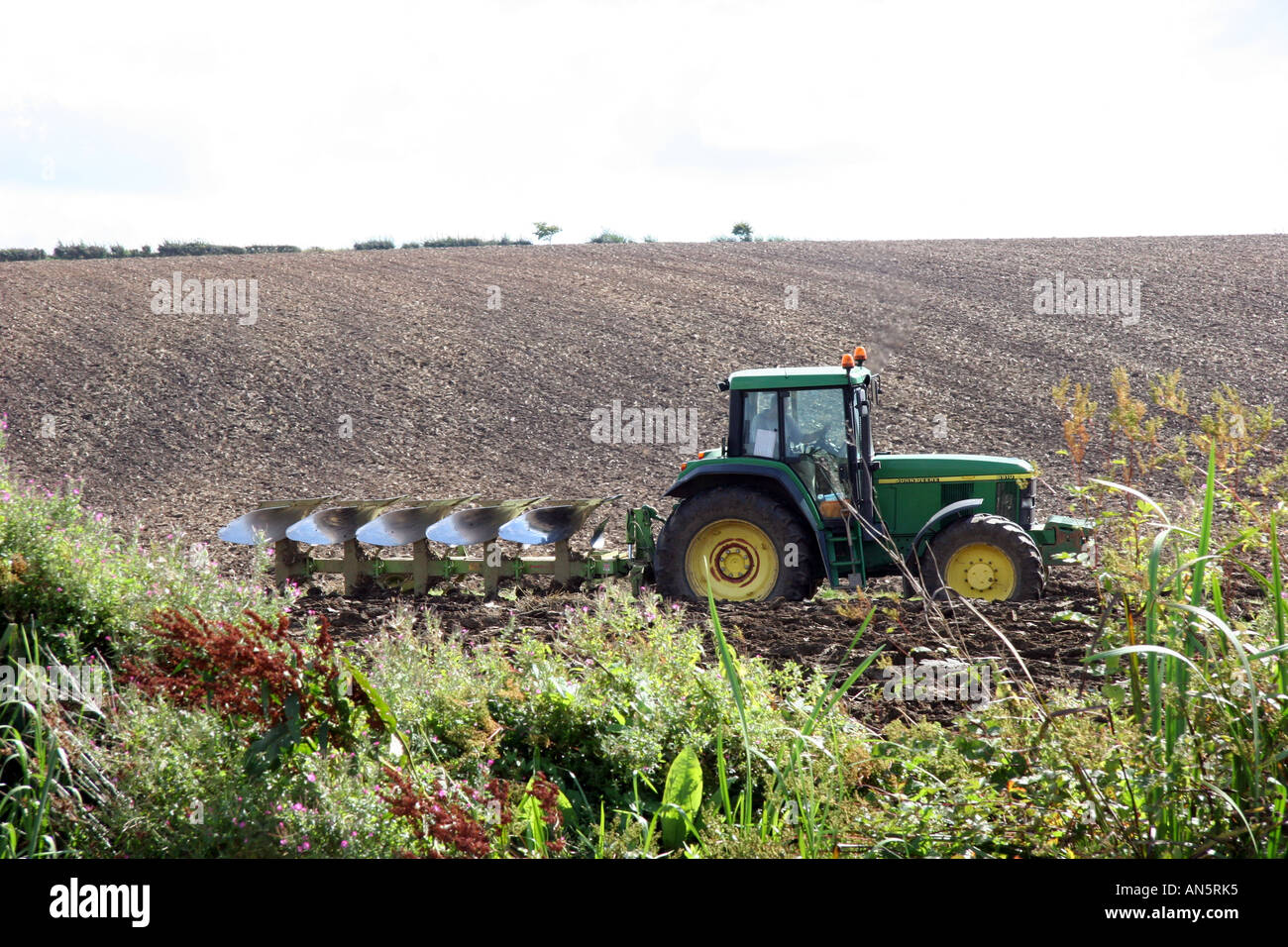 Farmer ploughing his field Stock Photo - Alamy