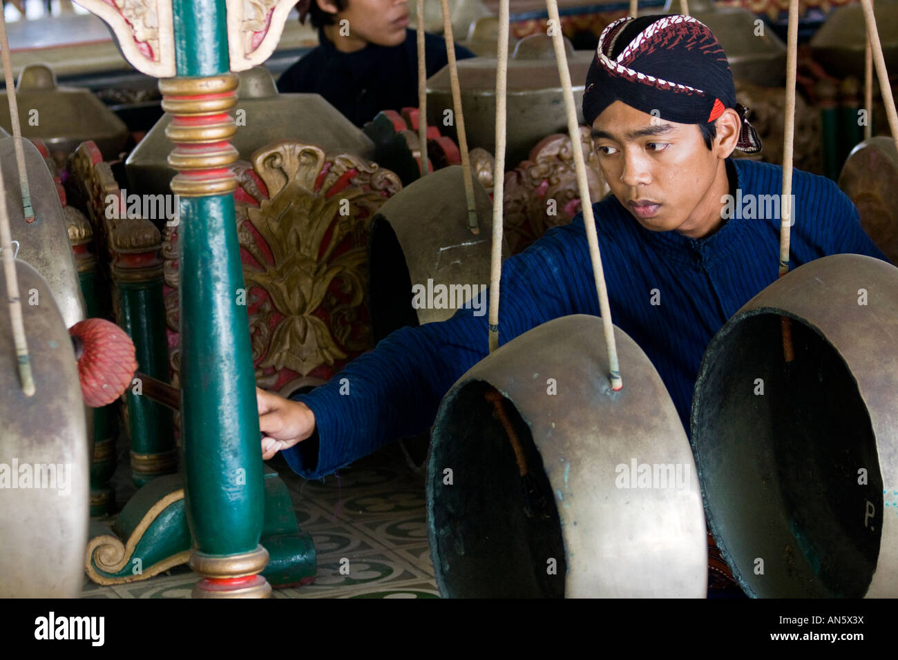 Traditional Gamelan Player Performing at the Royal Palace Yogyakarta Indonesia Stock Photo