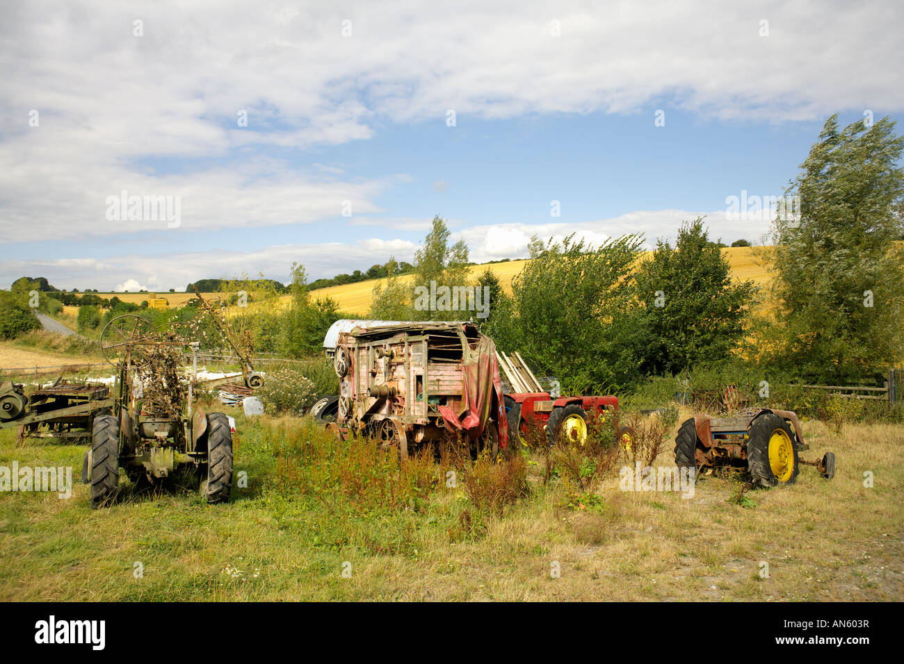 Old tractors on farmland in Wiltshire England English farming Stock