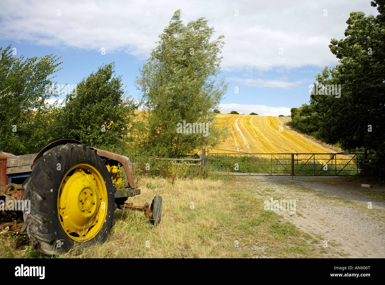 Old tractor on farmland in Wiltshire England English farming Stock