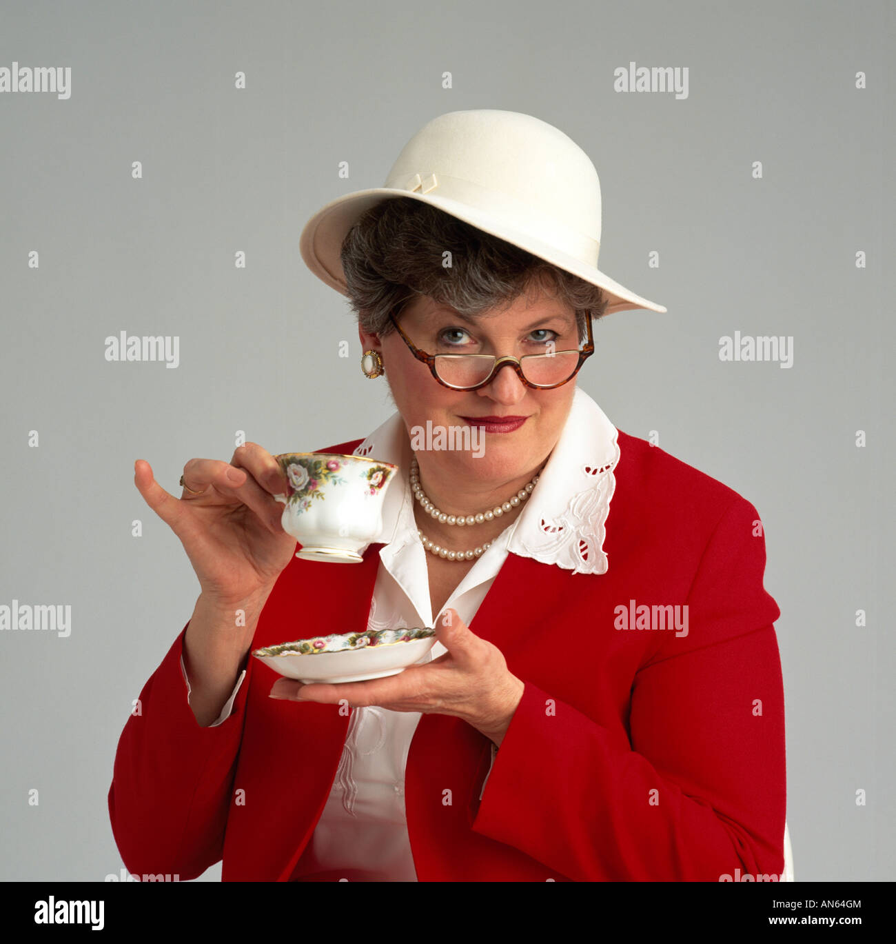 A woman having tea Stock Photo