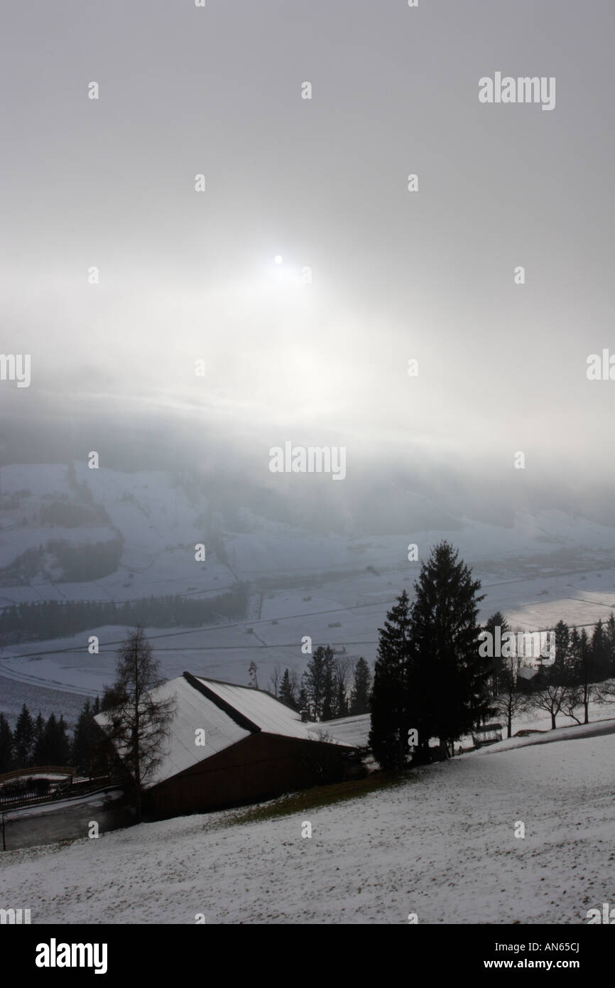 Foggy Winter Day near Mittersill Austria The Alps in the background are covered in snow A snowstorm has just passed Stock Photo
