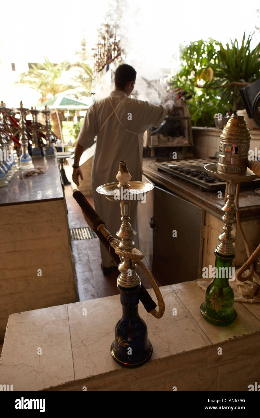 Man attending to hookahs at a cafe in Cairo Egypt Stock Photo Alamy