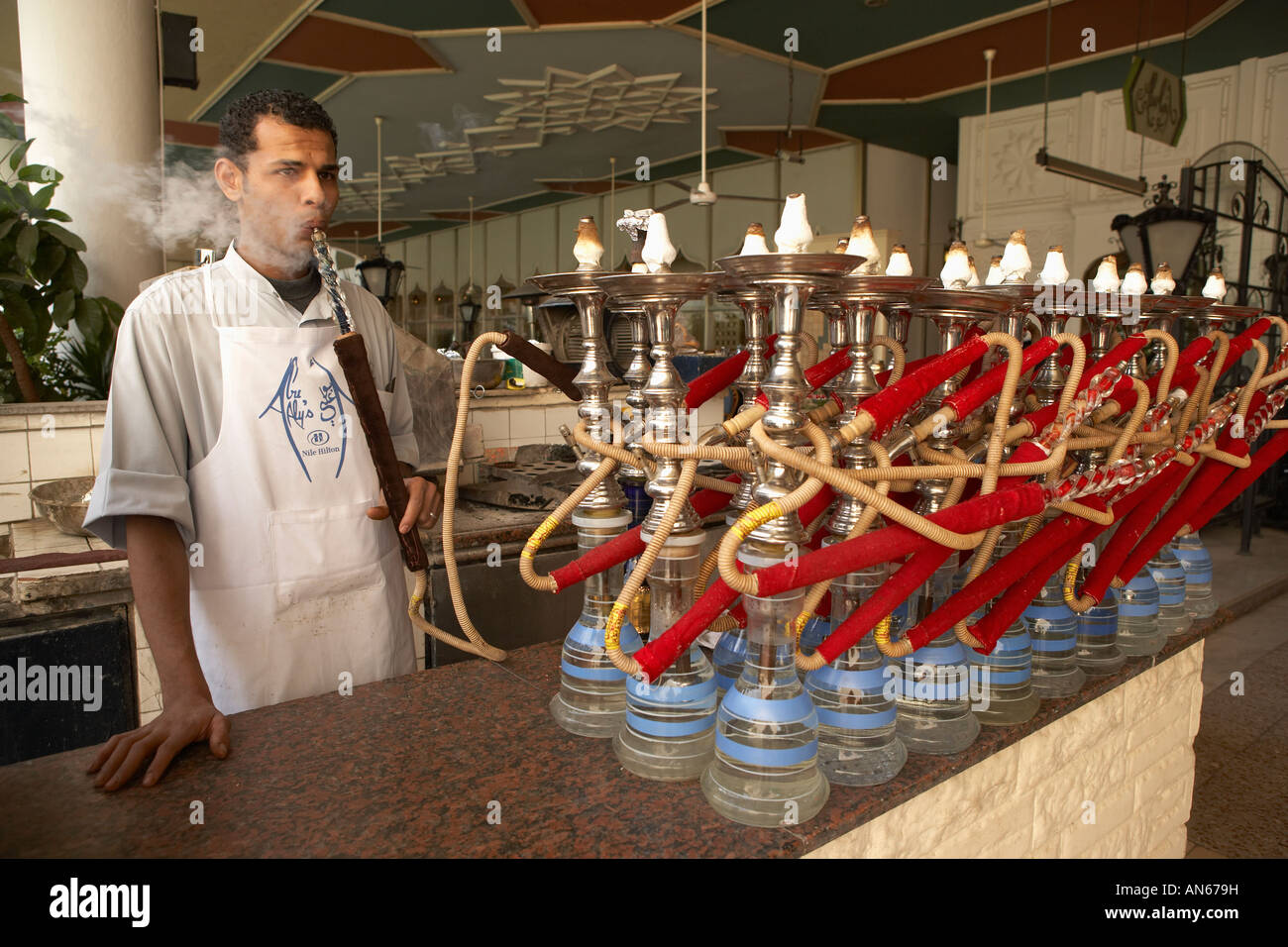 Man attending to hookahs at a cafe in Cairo Egypt Stock Photo Alamy