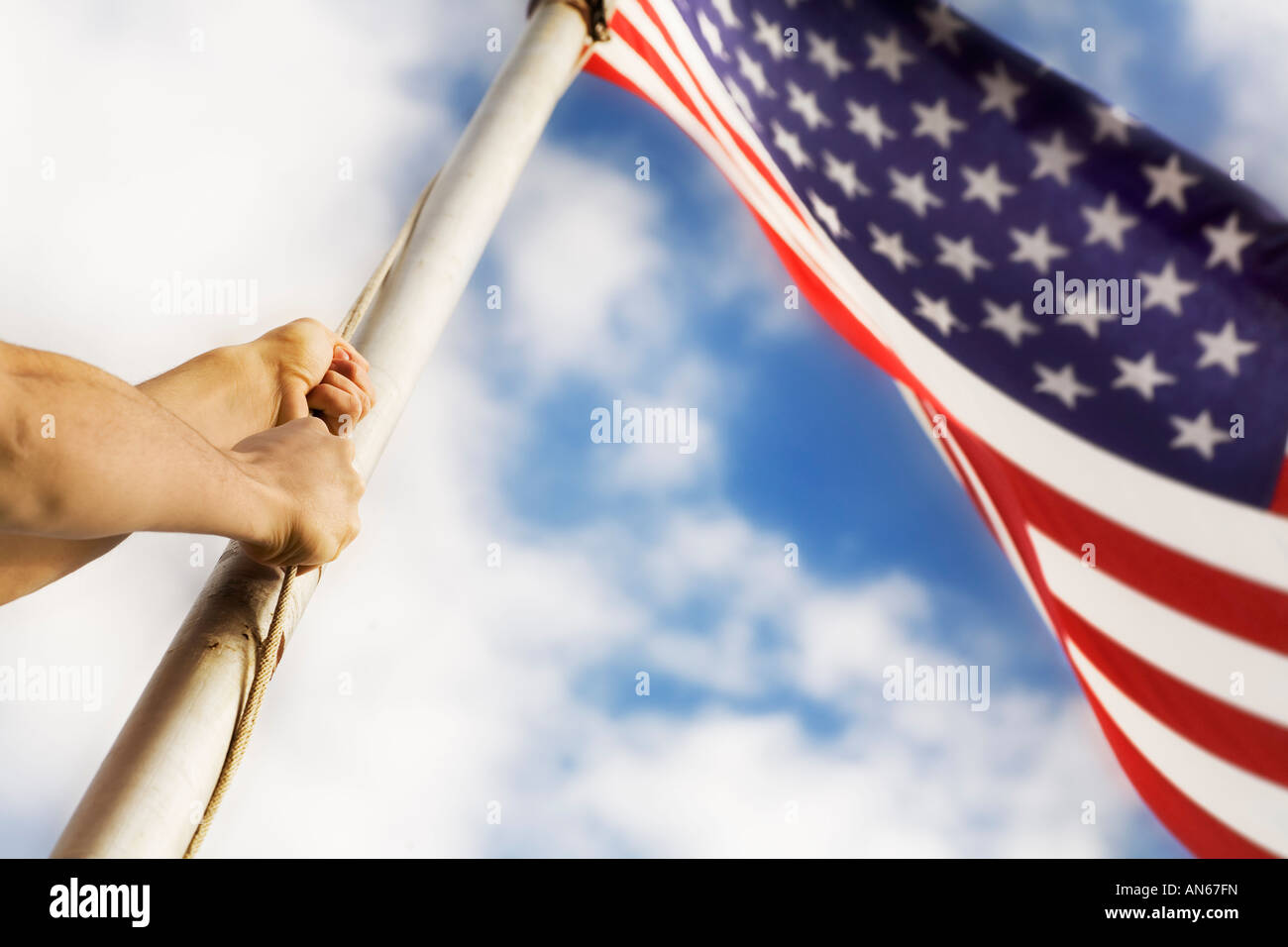 Raising an American flag Stock Photo