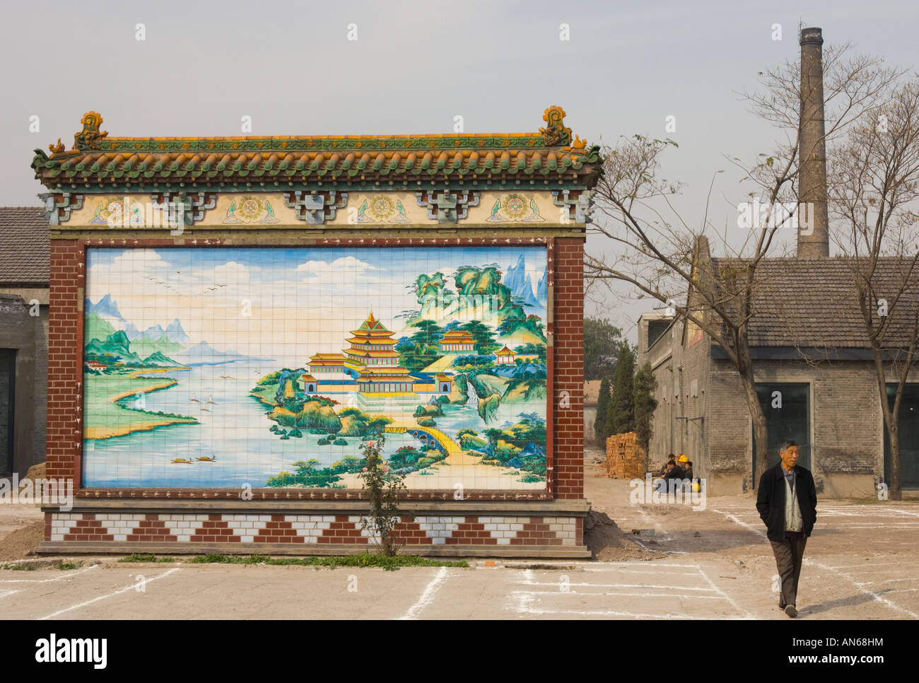China Shanxi Pingyao poor neighbourhood with chimney and decorated wall showing dreamy landscape Stock Photo