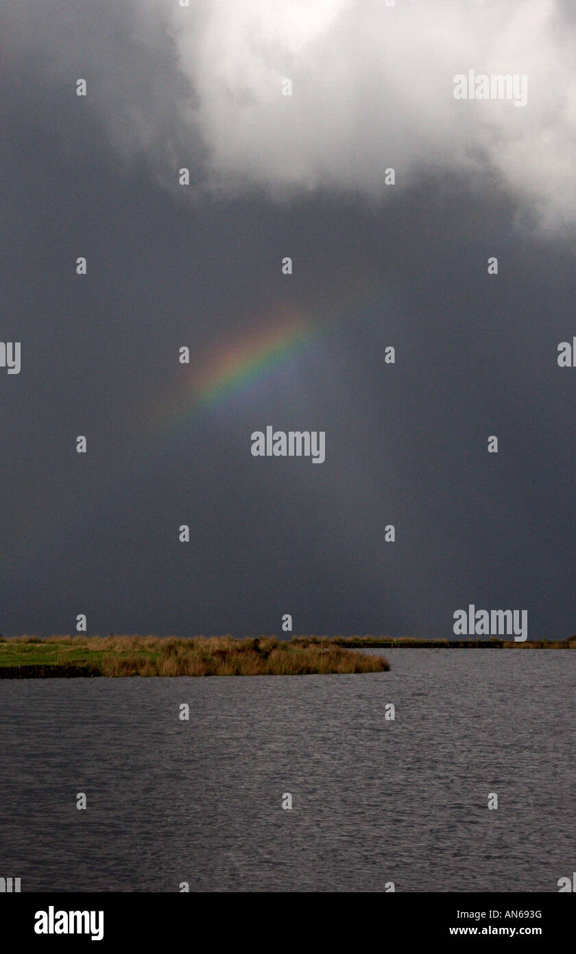 A clearing storm and rainbow at Keeper's Pond at the Blorenge Mountain