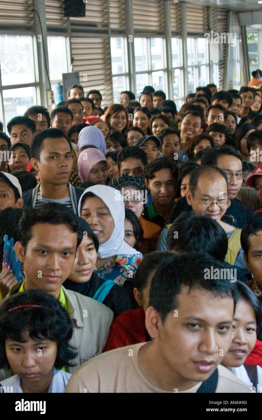 People Waiting on a Crowded Bus Platform Trans Jakarta Busway Rapid Transit System Jakarta Indonesia Stock Photo