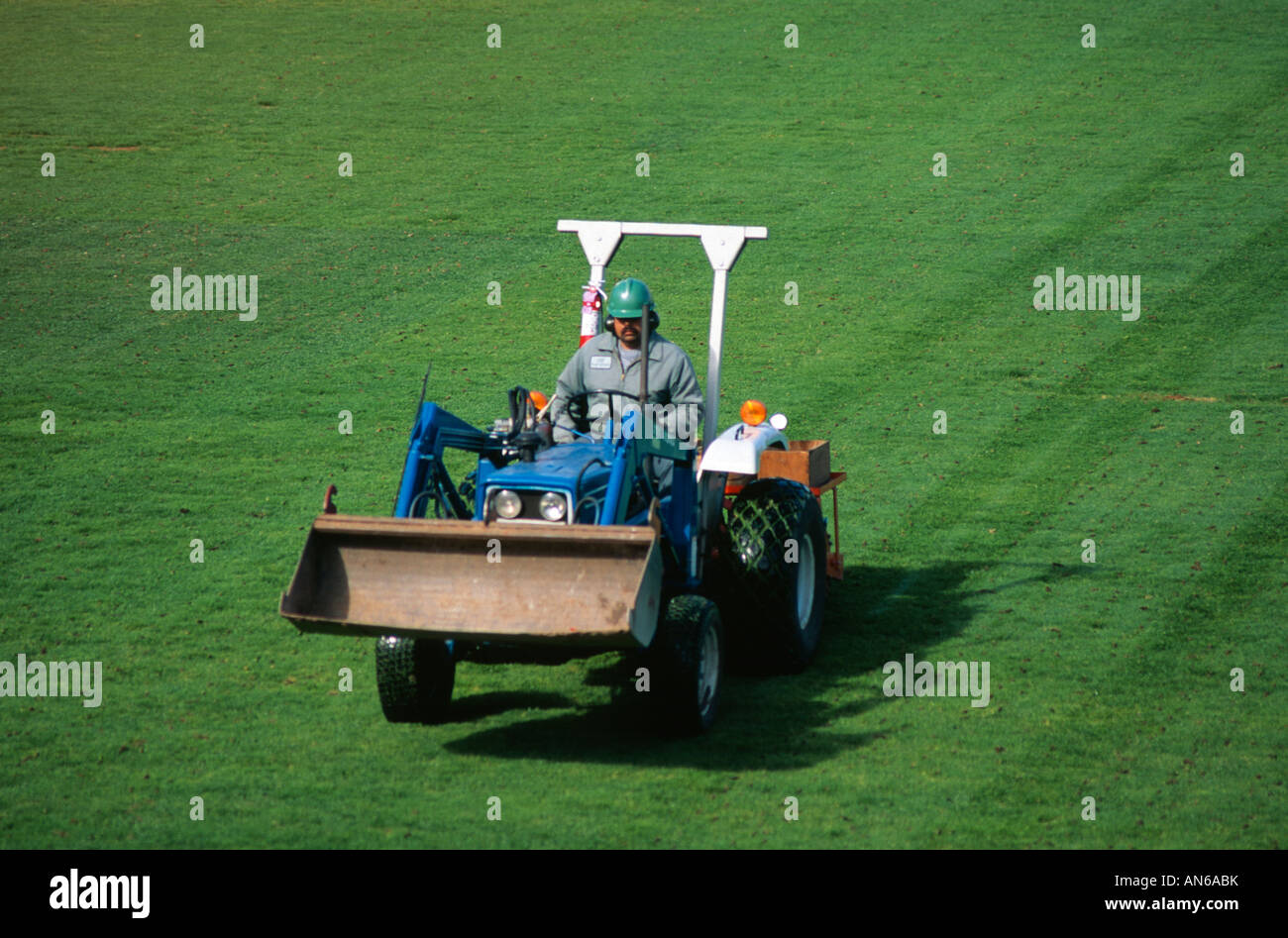 Man Riding Tractor Side View Man riding tractor hi-res stock photography and images - Alamy