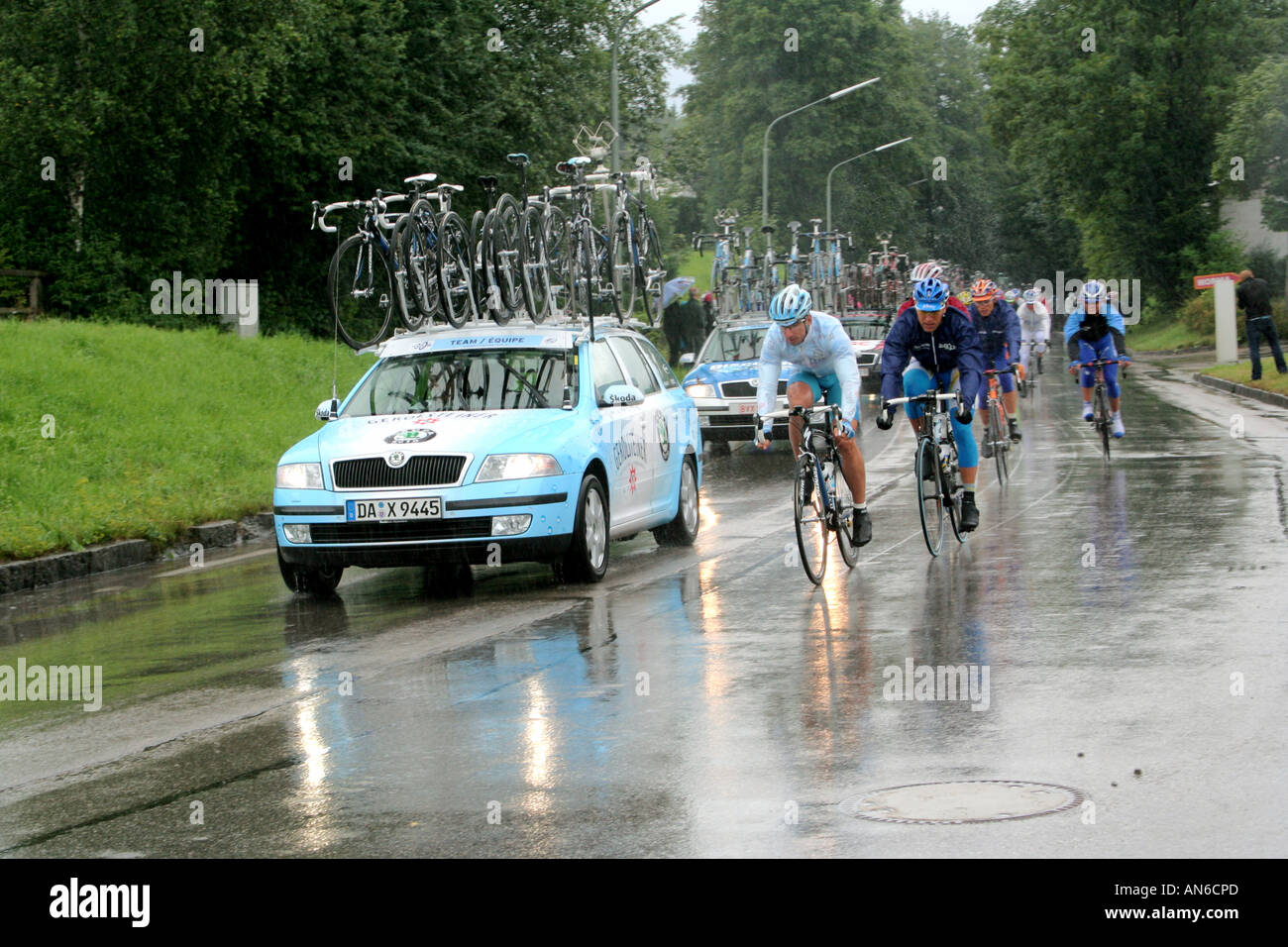 Cyclists and accompanying cars at the Professional bicycle race German Tour 2006 Bad Toelz Bavaria Germany Stock Photo