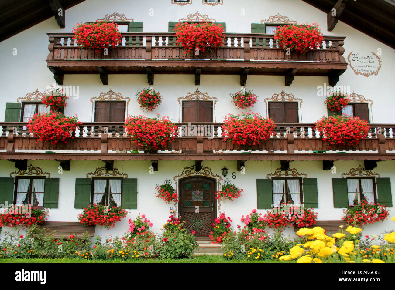 traditional Bavarian farmhouse richly decorated with flowers near Bad