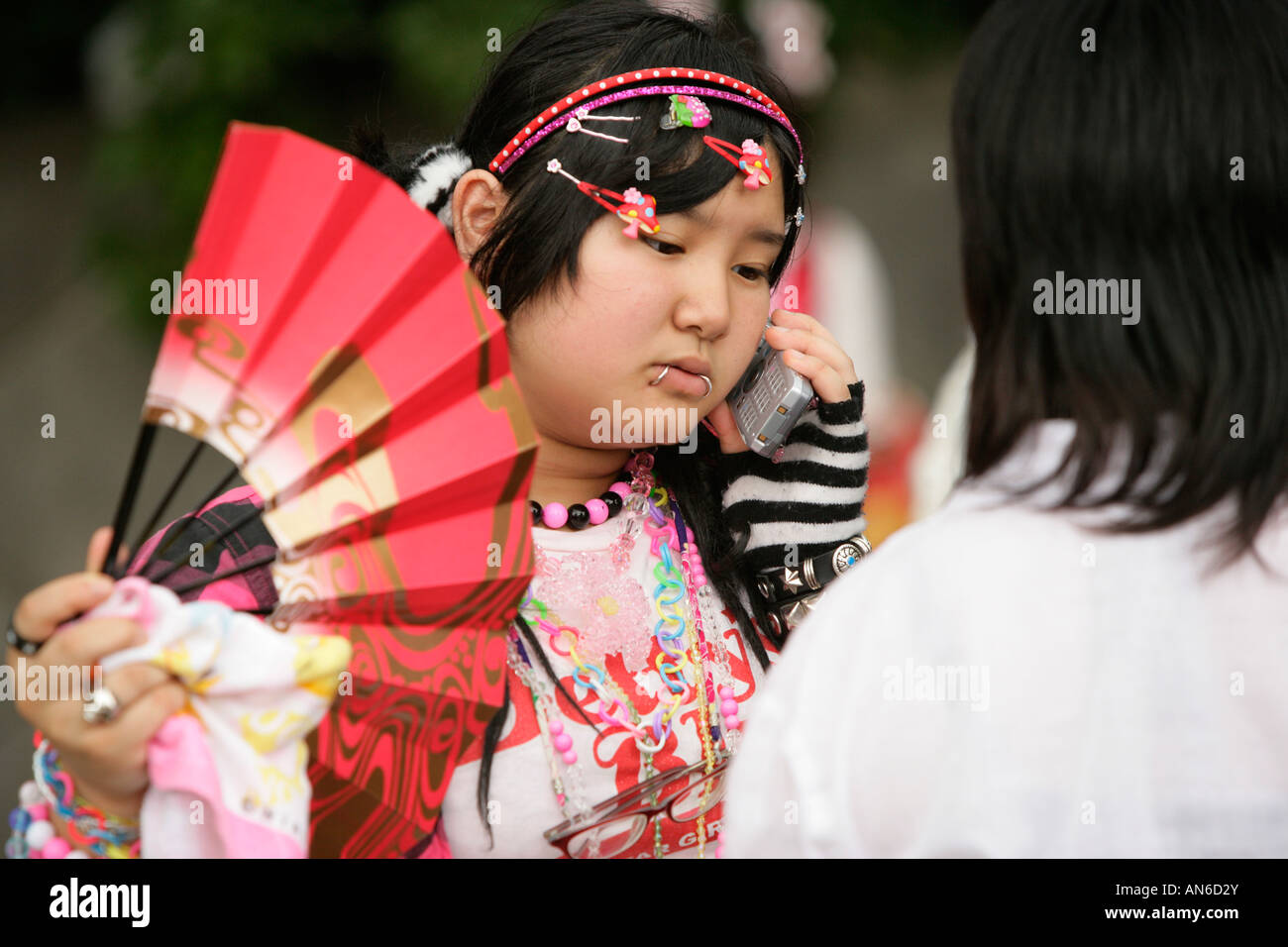 Teenage Girls Dressed In Alternative Street Fashion Relax In