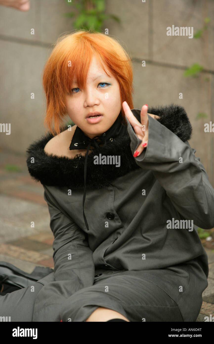 Teenage Girls Dressed In Alternative Street Fashion Relax In