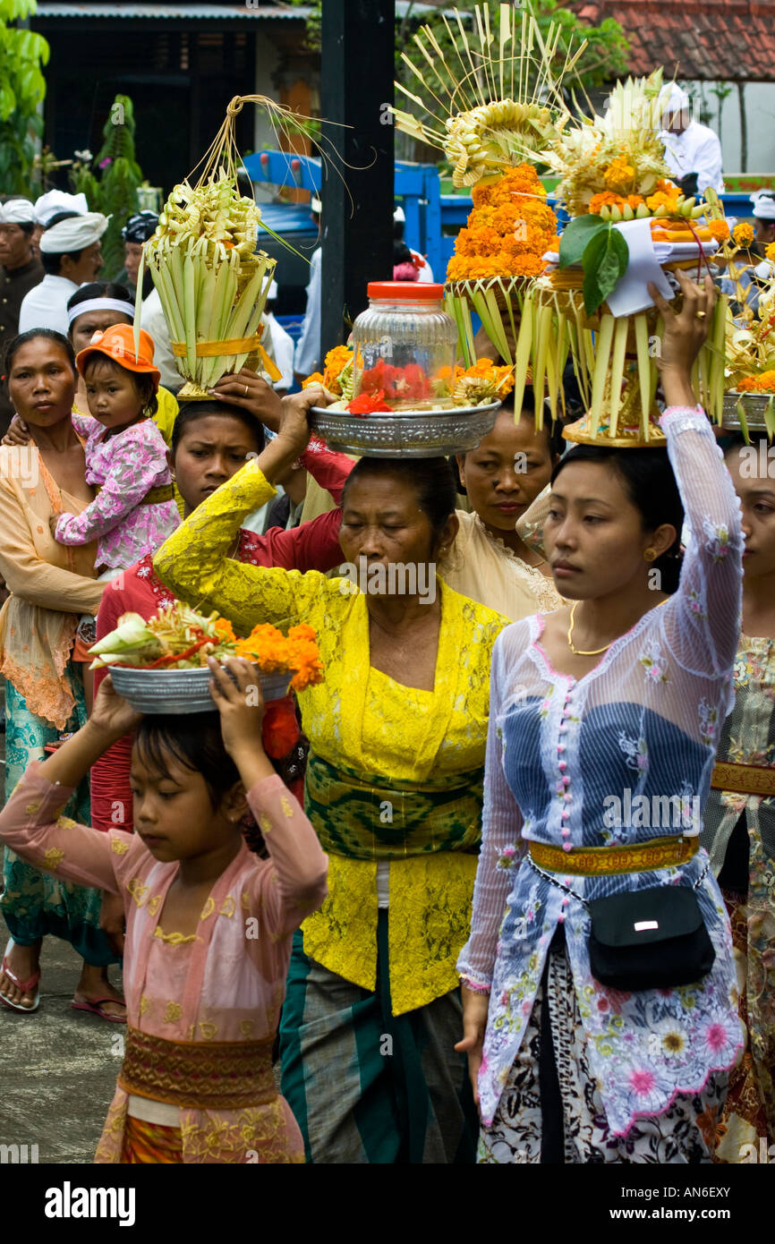 Women Carry Odalan Offerings Pura Basukian or Besakih Puseh Jagat Hindu Temple Bali Indonesia Stock Photo