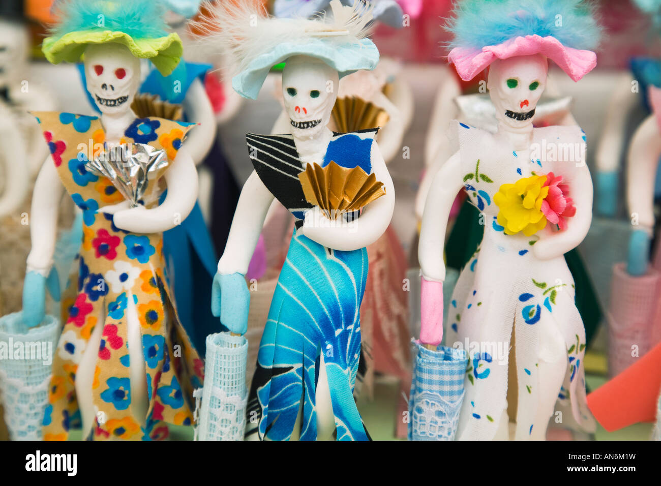MEXICO Guanajuato Three women sugar statues with skulls and fans colorful traditional Day of the Dead celebration Stock Photo