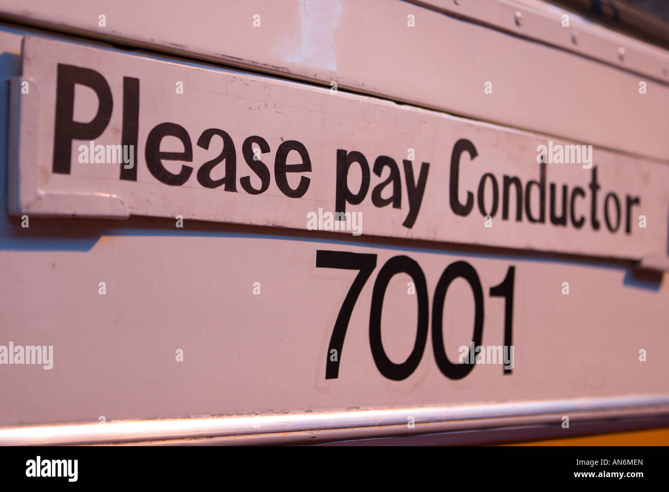 Sign on bus saying please pay conductor Stock Photo