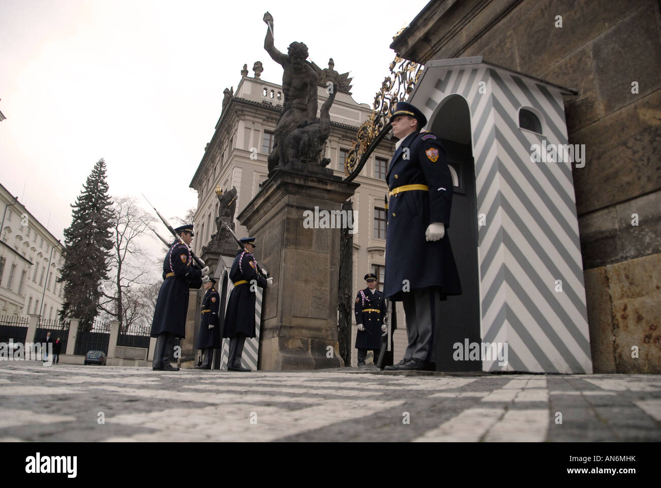 Castle guards stand firm during changing of guards process at the main entrance to Prague Castle in Czech republic Stock Photo