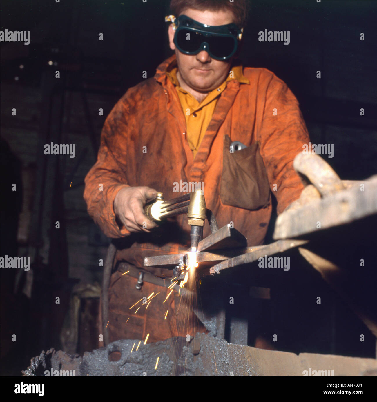 Man wearing eye protection welding in machine of Betws