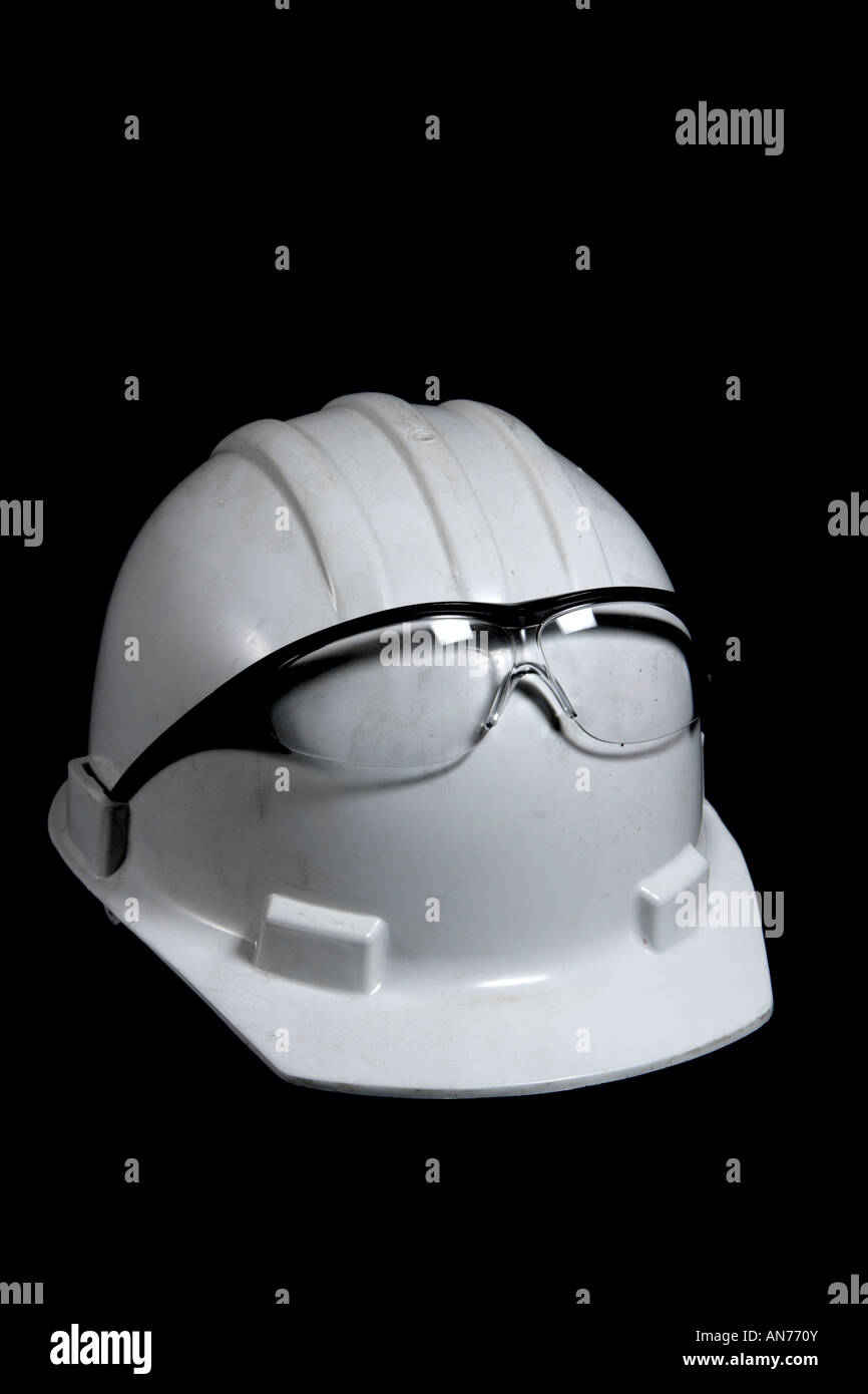 A hard hat with a pair of safety glasses Stock Photo Alamy