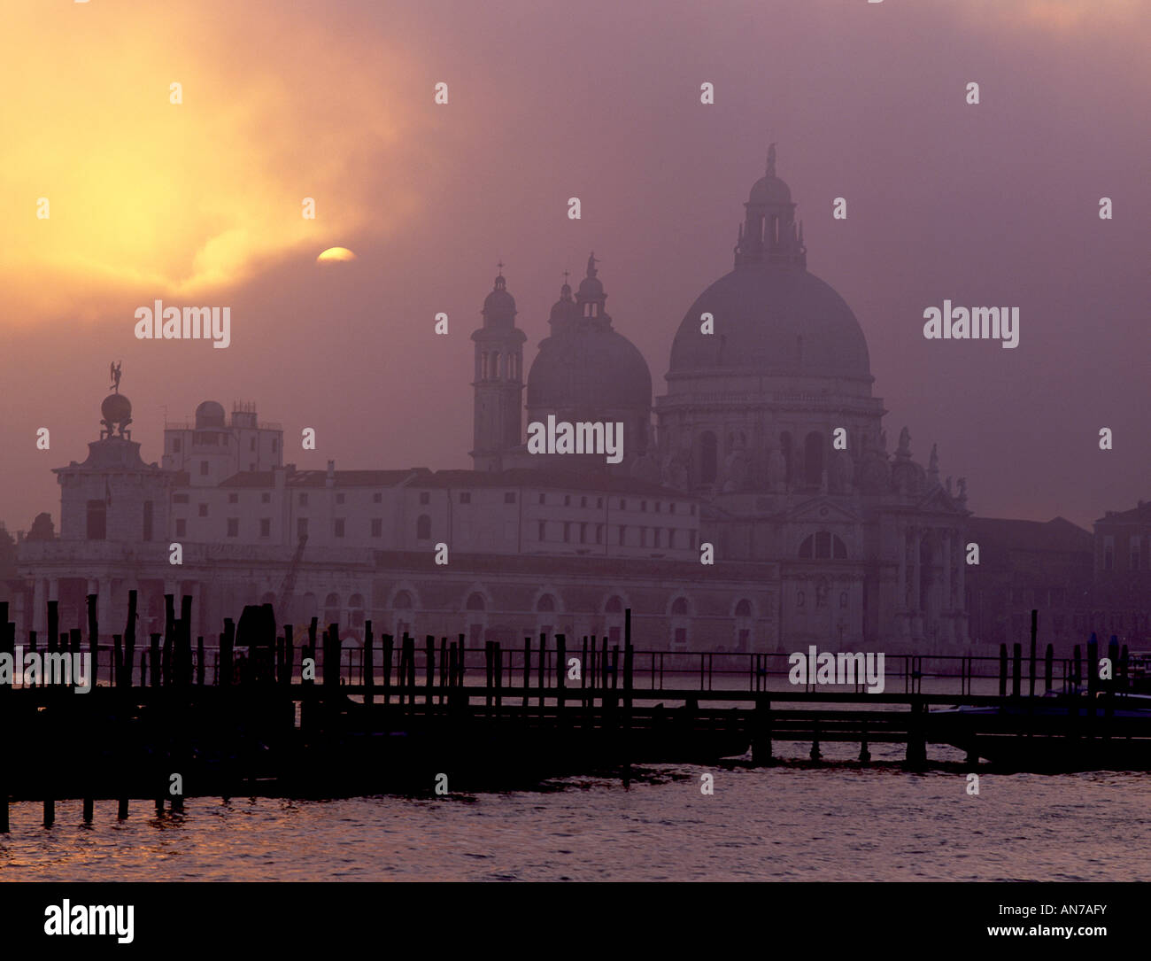 Santa Maria della Salute church and Grand Canal in misty sunset ...