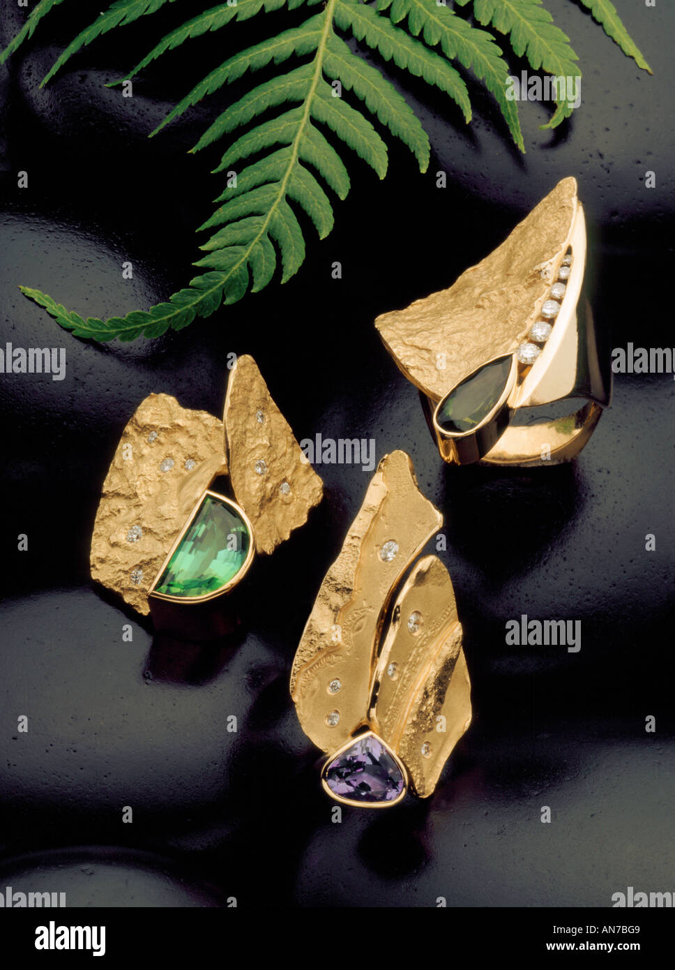 Custom made FINE GOLD JEWELRY RINGS set with TOURMALINE TANZANITE DIAMONDS Stock Photo