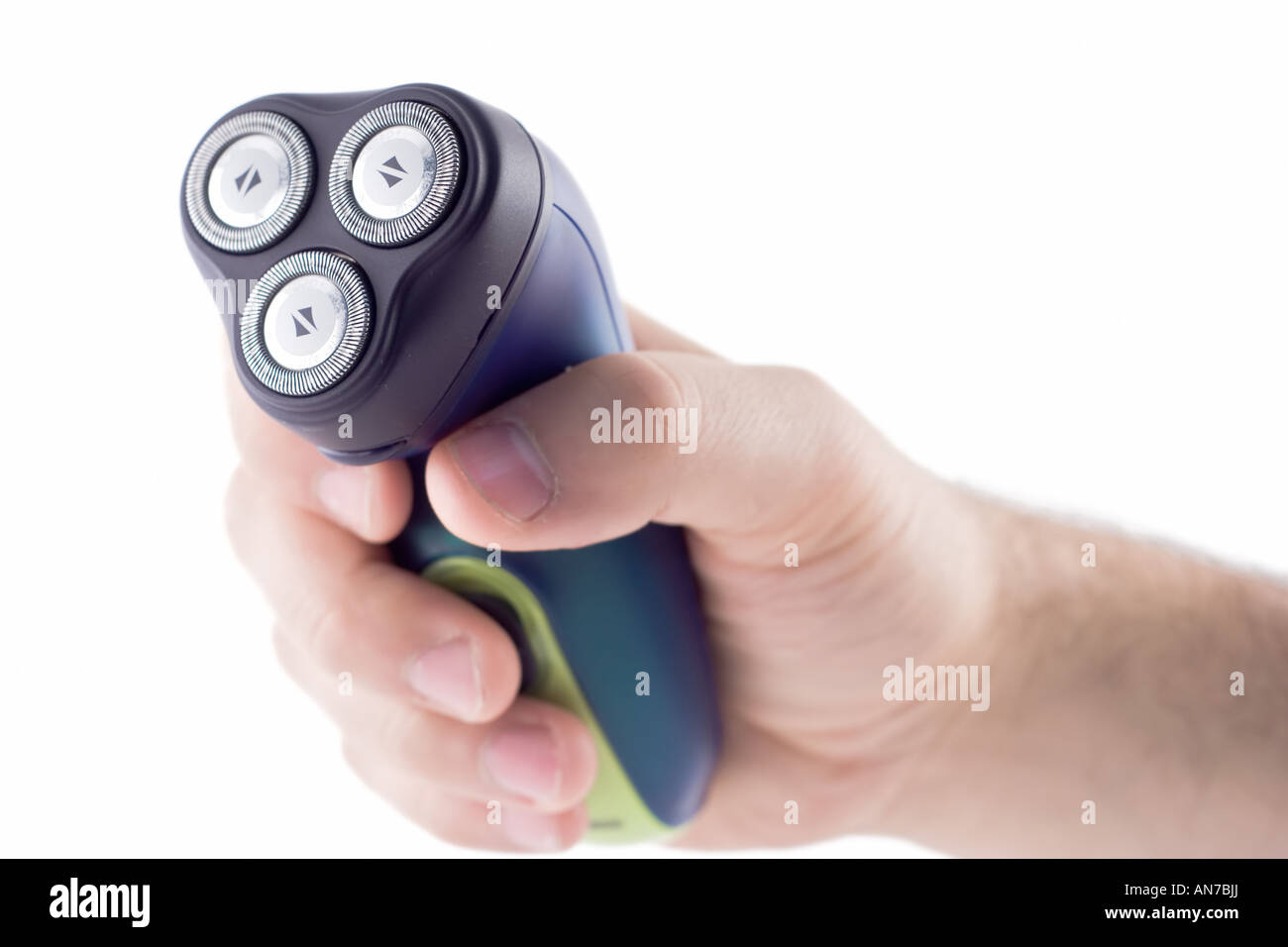 Hand holding electric shaver Stock Photo Alamy