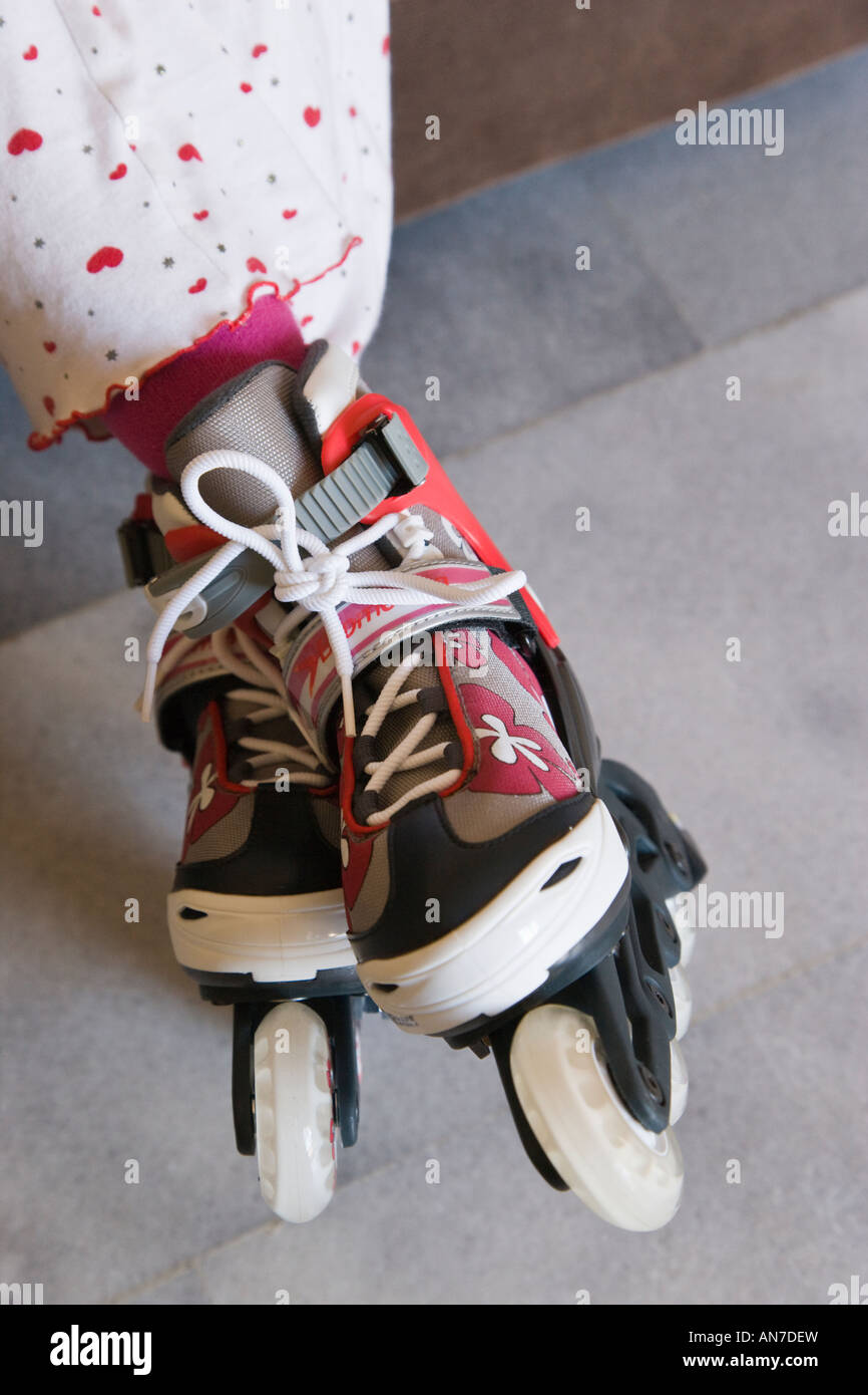 Roller blades on childs feet Stock Photo Alamy