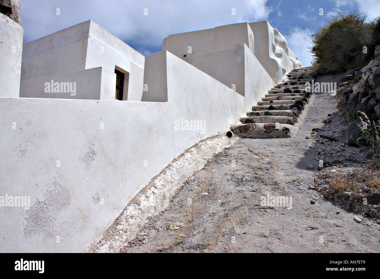 Akrotiri Stair Stairway up past a set of white washed cubist houses Akrotiri Santorini Greece Stock Photo