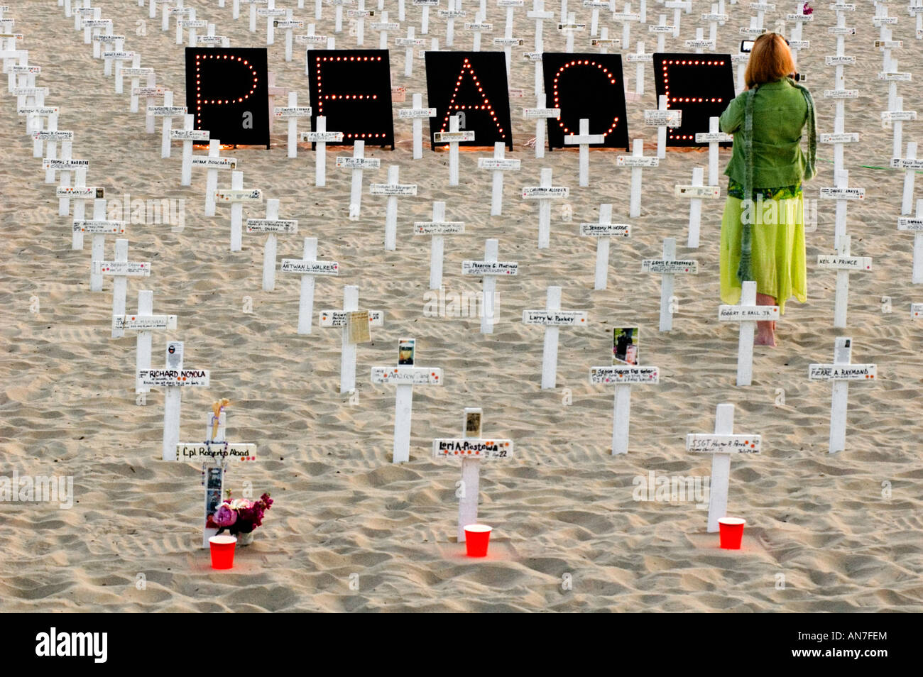 A visitor pays her respects to the American and Iraqi casualties  at the Arlington West site in Santa Barbara. Stock Photo