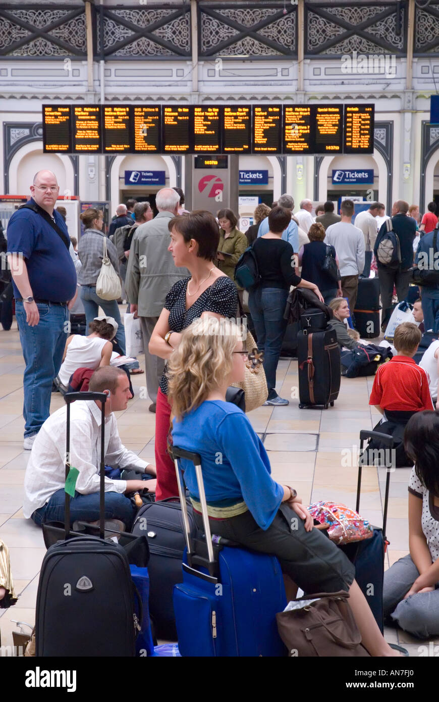 Delayed train passengers at Paddington rail station due to major line