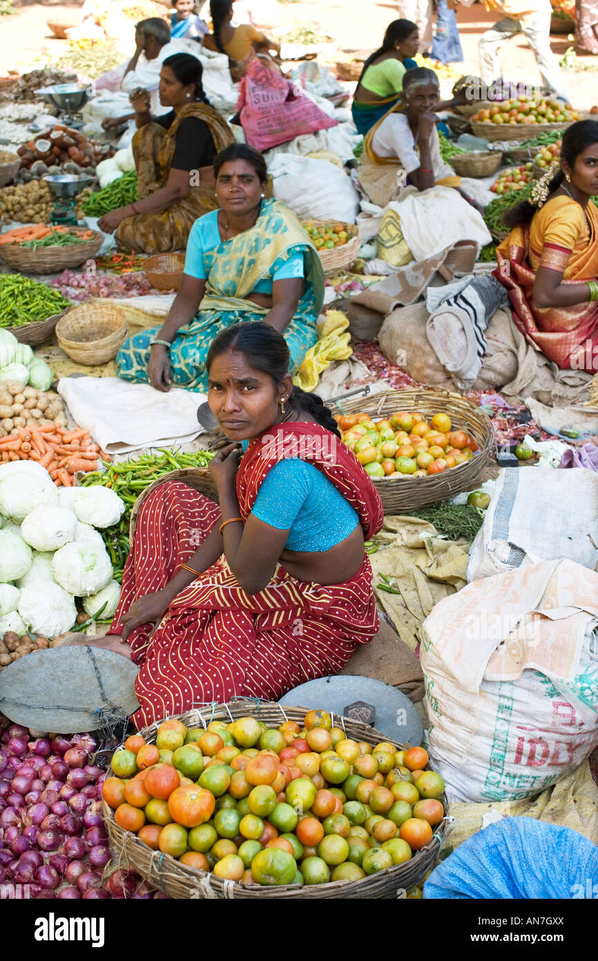 Indian women selling vegetables at a market. Puttaparthi, Andhra Pradesh, India Stock Photo