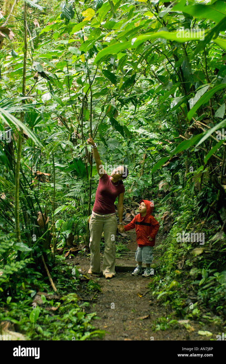 DISCOVERING THE RAINFOREST, Mother and son, Arenal COSTA RICA Stock Photo