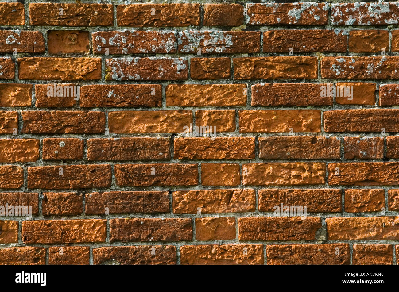 Ancient red weathered brick wall detail Stock Photo