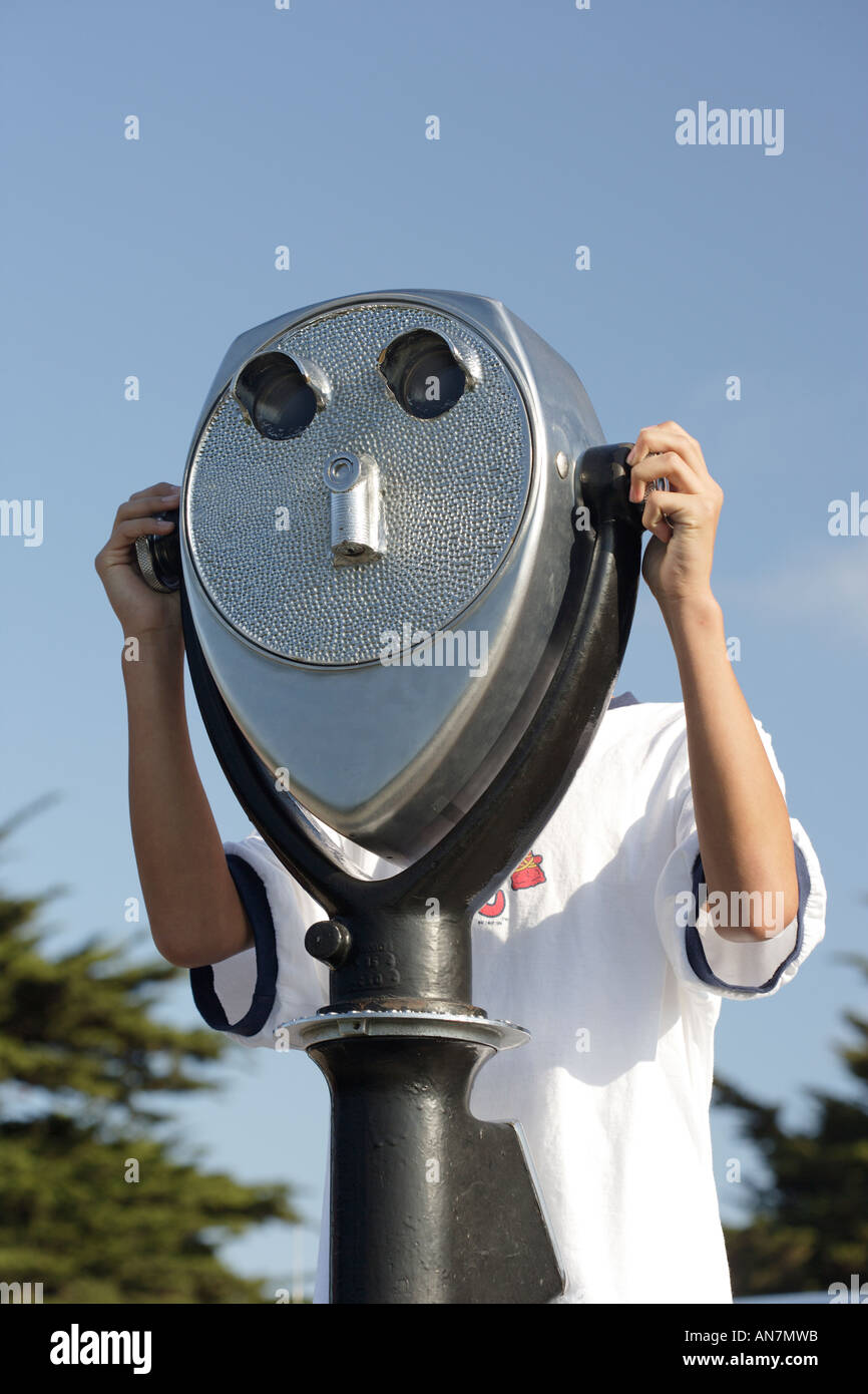 person looking through coin operated scenic binoculars Stock Photo