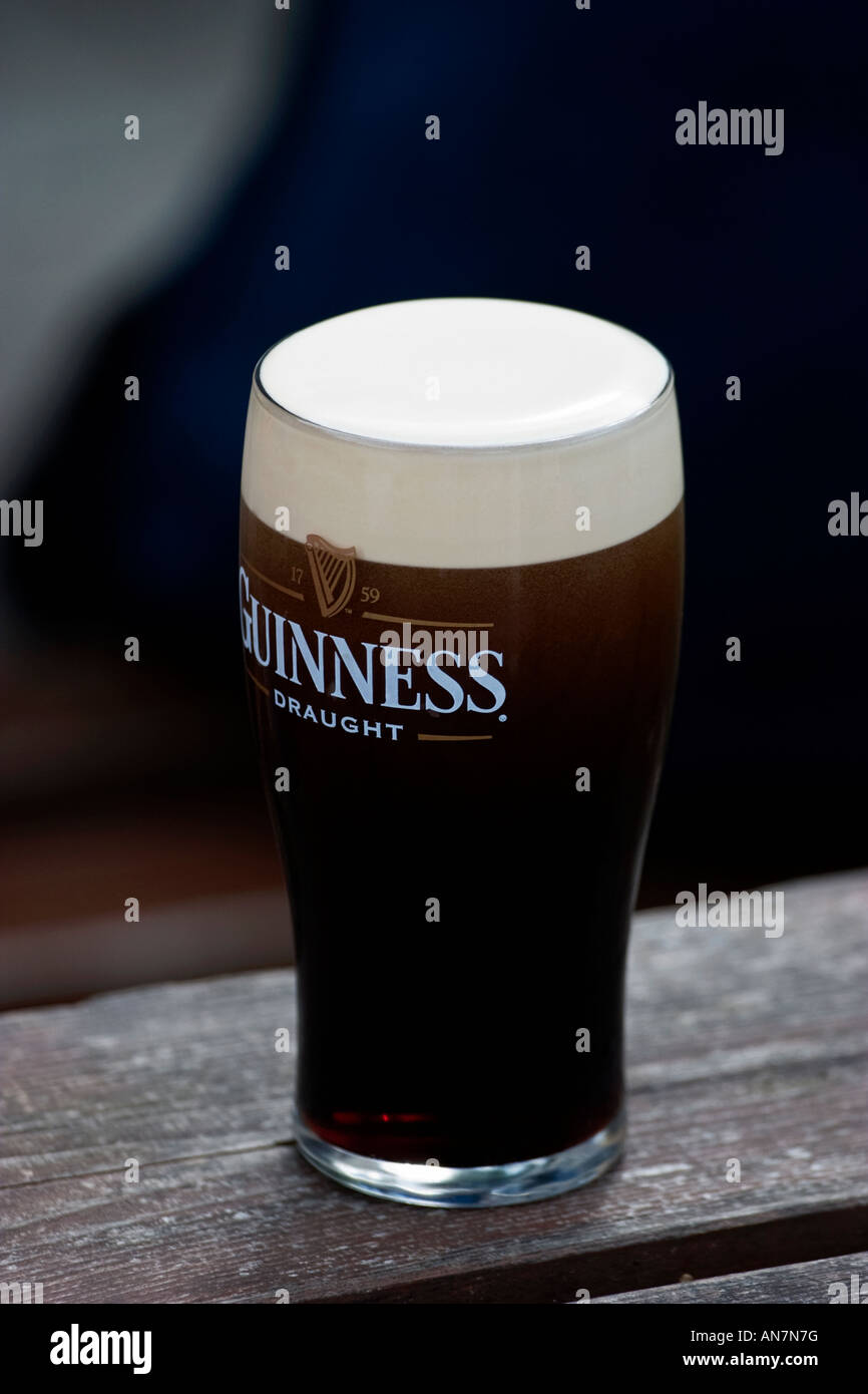 Glass of Guinness on the table Stock Photo Alamy