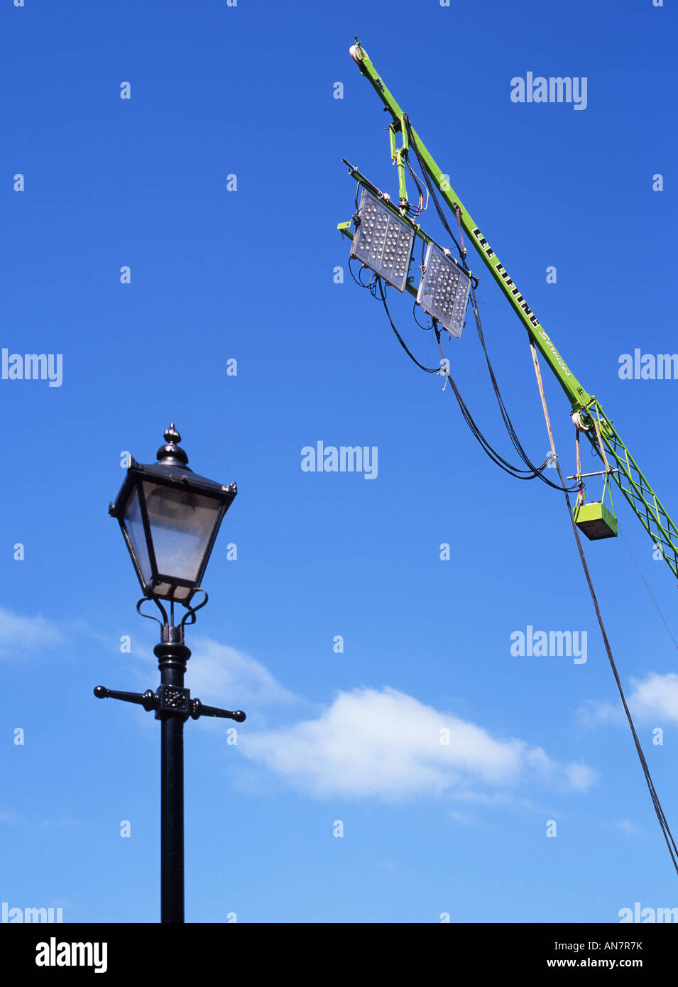 Crane with lighting rig for the film Stardust and nineteenth century street lamp Stock Photo